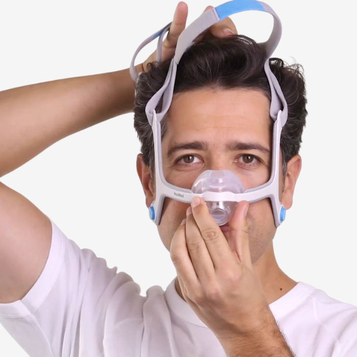 Front view of ResMed AirFit N20 nasal CPAP mask showing soft headgear and InfinitySeal cushion