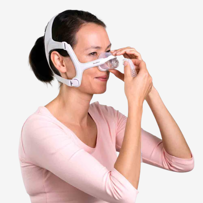Woman wearing ResMed AirFit N20 nasal CPAP mask for sleep apnea therapy comfort